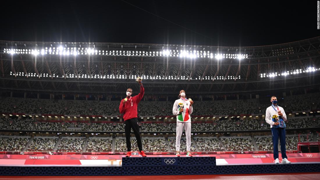 Qatar&#39;s Mutaz Essa Barshim, left, and Italy&#39;s Gianmarco Tamberi share the podium during a medal ceremony on August 2. &lt;a href=&quot;https://www.cnn.com/world/live-news/tokyo-2020-olympics-08-01-21-spt/h_86532abc405785d7c29b0fda0e27cdce&quot; target=&quot;_blank&quot;&gt;They agreed to share the gold medal in high jump&lt;/a&gt; after they both cleared 2.37 meters but failed to clear 2.39. Beside them is bronze medalist Maksim Nedasekau of Belarus. No one was given a silver medal.
