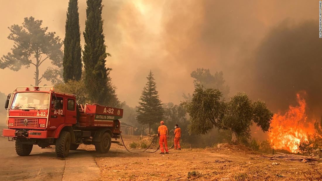Firefighters battle a massive wildfire that engulfed a Mediterranean resort region on Turkey&#39;s southern coast near the town of Manavgat on July 29.