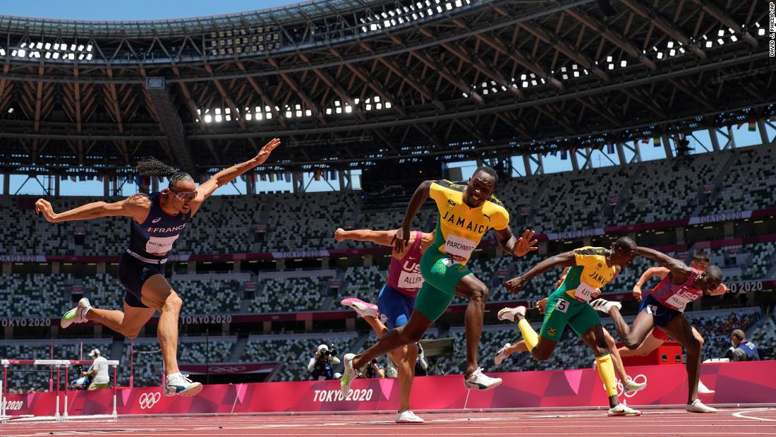 Jamaica&#39;s Hansle Parchment, third from left, &lt;a href=&quot;https://www.cnn.com/world/live-news/tokyo-2020-olympics-08-04-21-spt/h_fc93790d8fbfbb7e24eb0e1c79d16530&quot; target=&quot;_blank&quot;&gt;wins the 110-meter hurdles&lt;/a&gt; on August 5. He finished with a time of 13.04 seconds, just beating out the United States&#39; Grant Holloway, who ran a 13.09.