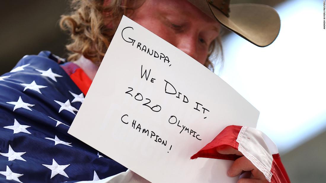 The United States&#39; Ryan Crouser shows a message for his grandfather after &lt;a href=&quot;https://www.cnn.com/world/live-news/tokyo-2020-olympics-08-04-21-spt/h_fc93790d8fbfbb7e24eb0e1c79d16530&quot; target=&quot;_blank&quot;&gt;winning gold in the shot put&lt;/a&gt; on August 5. Crouser, who also won gold at the 2016 Games, set a new Olympic record with a throw of 23.30 meters. It&#39;s the second-longest throw in history.