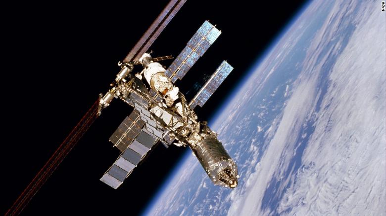 NASA astronauts conduct spacewalk postponed due to debris risk