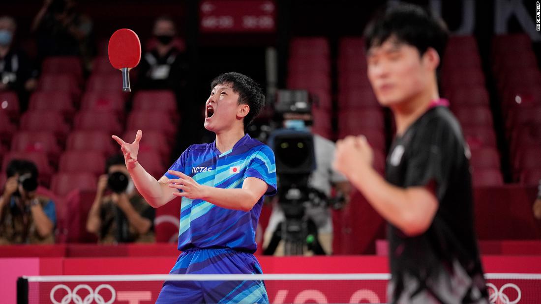 Japan&#39;s Tomokazu Harimoto, left, celebrates after defeating South Korea&#39;s Jang Woo-jin to win a bronze medal in table tennis on August 6.