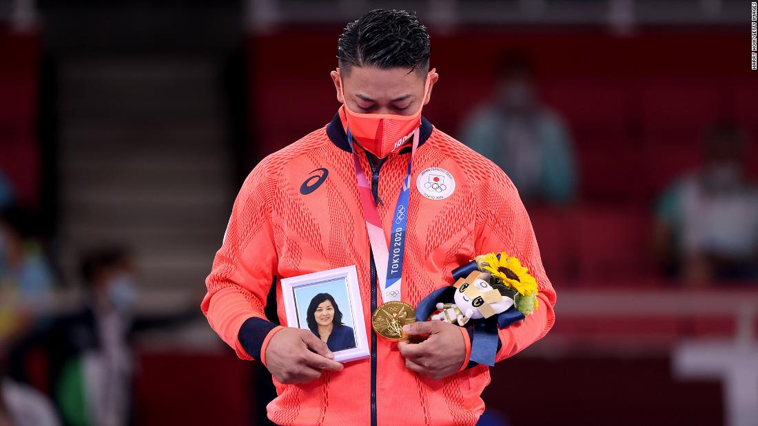 Japan&#39;s Ryo Kiyuna holds a photo of his late mother after &lt;a href=&quot;https://www.cnn.com/world/live-news/tokyo-2020-olympics-08-06-21-spt/h_847fb05b498eda3551989c461857a2e8&quot; target=&quot;_blank&quot;&gt;winning gold in karate&#39;s kata event&lt;/a&gt; on August 6. Kiyuna is from the island of Okinawa, which is considered the birthplace of karate.