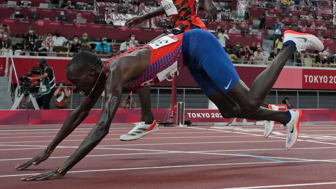 The United States&#39; Paul Chelimo dives over the finish line to win a bronze medal in the 5,000 meters on August 6. He finished just ahead of Kenya&#39;s Nicholas Kipkorir Kimeli.