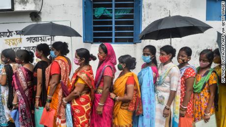 Women wait to receive the Covishield vaccine at a health center in Siliguri, West Bengal. India blocked vaccine exports in March to battle a devastating second wave of infections.