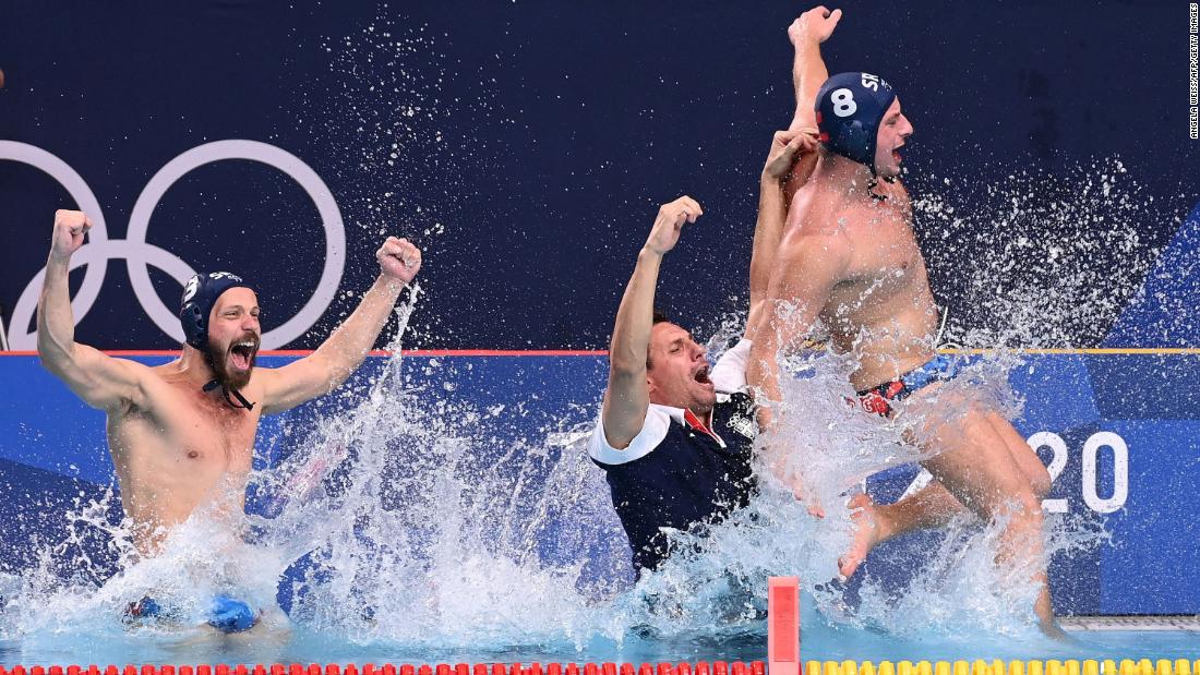 Serbia&#39;s Nikola Dedović, Vladimir Vujasinović and Milan Aleksić jump into the pool as they celebrate winning &lt;a href=&quot;https://www.cnn.com/world/live-news/tokyo-2020-olympics-08-08-21-spt/h_a15625c29c75324d0b2fcf55f37f79ac&quot; target=&quot;_blank&quot;&gt;the water polo final against Greece &lt;/a&gt;on August 8. Serbia won the match 13-10.