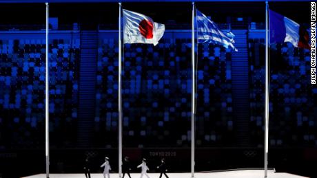 The national flags of Japan, Greece and France fly during the closing ceremony of the Tokyo 2020 Olympic Games at the Olympic Stadium on August 8, 2021.