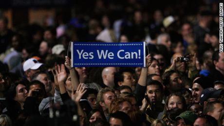 An Obama supporter holds up a sign reading &quot;Yes we can&quot; as  President-elect Barack Obama gives his election night victory speech on November 4, 2008, in Chicago&#39;s Grant Park. 