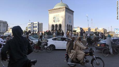 Taliban militants gather a day after taking control of Kandahar on August 14. 