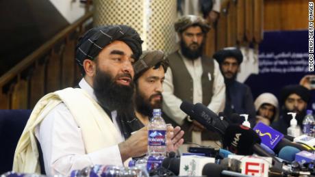 Spokesman Zabihullah Mujahid conducts the Taliban&#39;s first news conference since they seized power in Afghanistan.