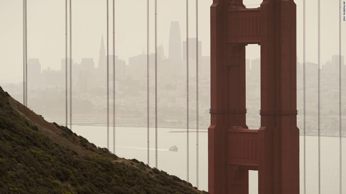 Smoke and haze from wildfires obscure the Golden Gate Bridge and the San Francisco skyline on August 18.