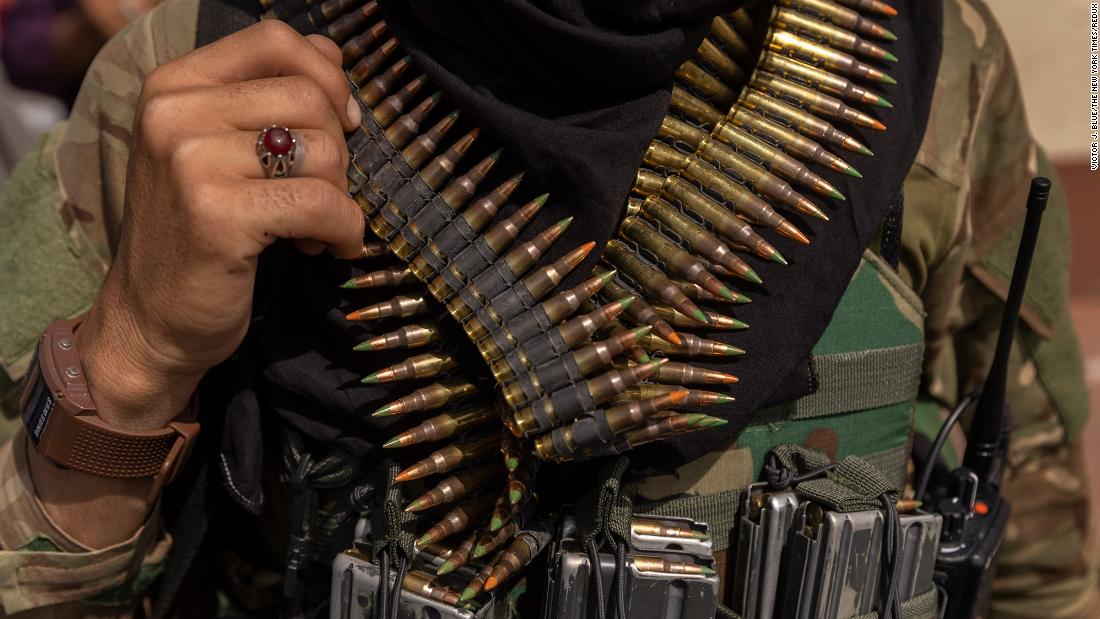 A heavily armed Taliban fighter guards the Afghanistan central bank in Kabul on August 19.