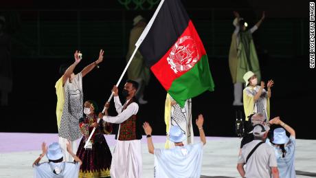 Flag bearers of Team Afghanistan during the Opening Ceremony of the Tokyo 2020 Olympic Games.