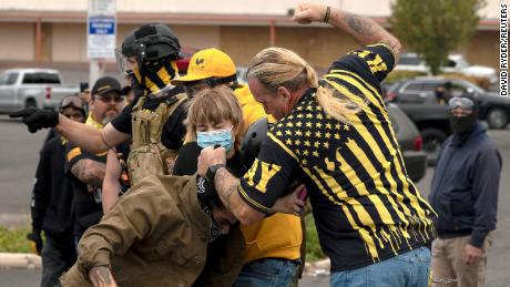 Members of the far-right Proud Boys brawl with counterprotesters during rival rallies in Portland on Sunday.