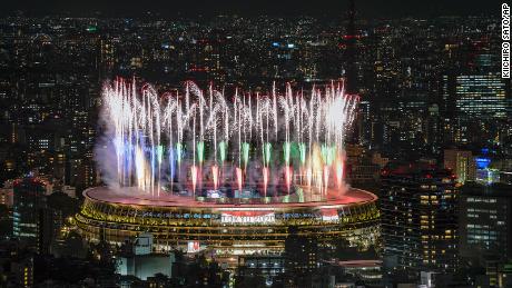 Fireworks illuminate the skies of Tokyo over the National Stadium during the Opening Ceremony.