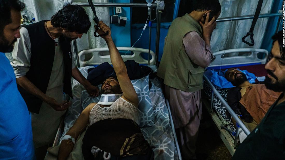 People who were injured in the August 26 suicide bombing are visited by family members at a hospital in Kabul.