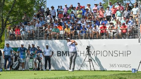 Rahm hits a shot on the first tee  during the first round of the BMW Championship.