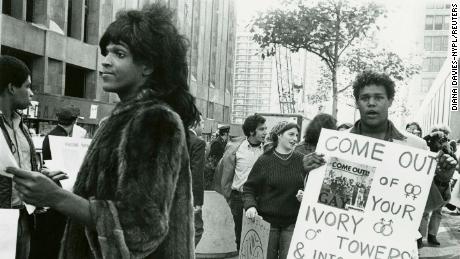 A 1970 photo of Marsha P. Johnson handing out flyers in support of Gay Students at NYU is seen here courtesy of the New York Public Library&#39;s &quot;1969: The Year of Gay Liberation&quot; exhibit. 