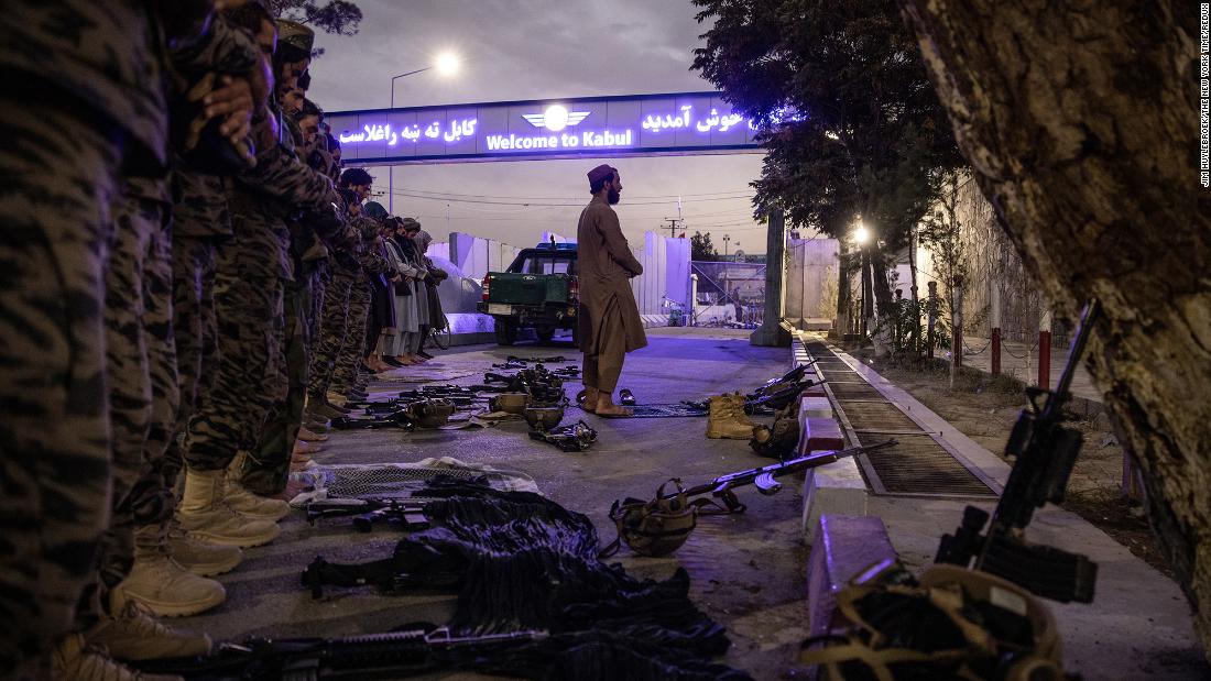Members of the Badri 313 Battalion, a group of Taliban special forces fighters tasked with securing the area surrounding the Kabul airport, perform evening prayers on August 28.