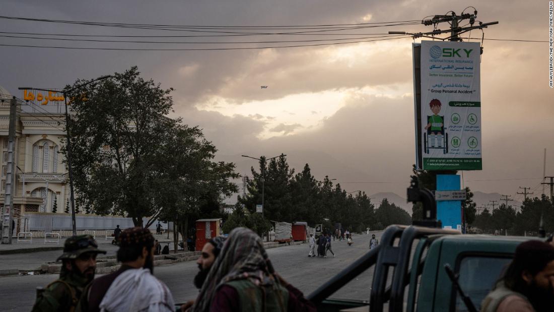 A C-17 military transport plane is a dot in the sky as it leaves Kabul on August 30.