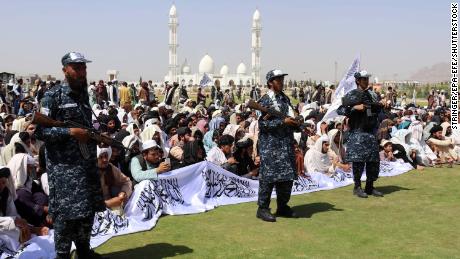 Taliban supporters gather to listen to the Taliban&#39;s governor for Kandahar province.