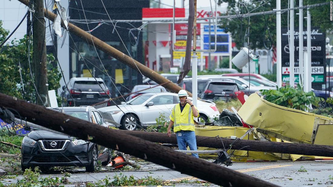 A worker surveys damage in Annapolis, Maryland, on September 1.
