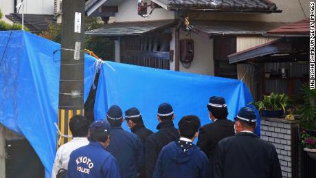 Investigators search the home of Chisako Kakehi and her deceased husband Isao on November 20, 2014, in Muko, Japan.