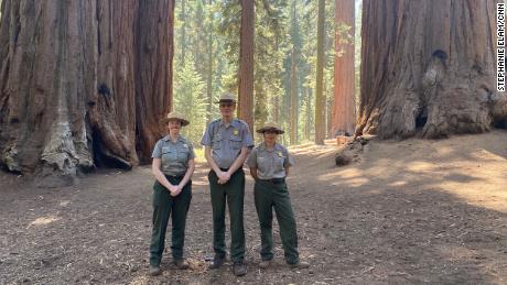 From left, Rebecca Paterson, Superintendent Clay Jordan and Christy Brigham from Sequoia &amp; King Canyons National Parks near monarch giant sequoias. 