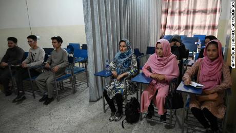 Curtains separate male and female Afghan students as new term begins under Taliban rule