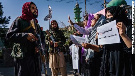 Taliban fighters use whips against Afghan women protesting the all-male interim government