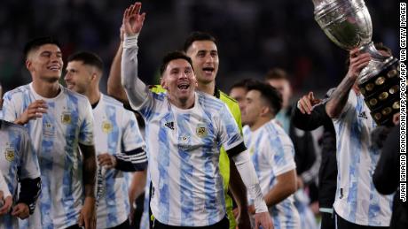 Messi and Argentina celebrate with the Copa América trophy in front of fans in Buenos Aires.