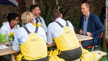 Prince William speaks with Royal National Lifeboat Institution crew in London on September 9.