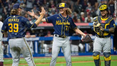 Brewers starting pitcher Corbin Burnes (39) greets relief pitcher Josh Hader as Omar Narvaez watches at the end of a baseball game against the Cleveland Indians on Saturday.