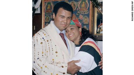 Muhammad Ali with his daughter Maryum &quot;May May&quot; Ali in 1988, wearing the boxing robe gifted by Elvis Presely that he would donate to New York&#39;s Hard Rock Café.
