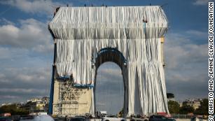 Why Is Paris Arc De Triomphe Covered In Silver Fabric Cnn Video