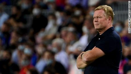 Dutch coach Koeman watches on during his side&#39;s 3-0 defeat.