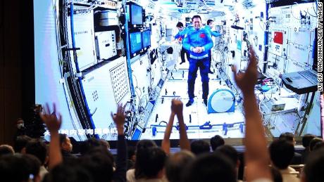 Astronauts in the Tiangong space station on video call with researchers on Earth via video link on September 3.