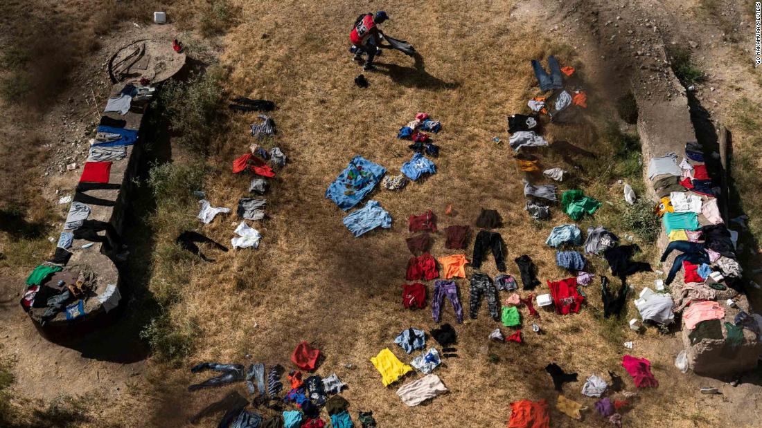 Clothes are laid out on the ground to dry under the International Bridge in Del Rio on Wednesday, septiembre 15.