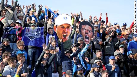 European fans display giant pictures of Rory McIlroy and Sergio Garcia during the morning fourball matches of the 2018 Ryder Cup at Le Golf National.