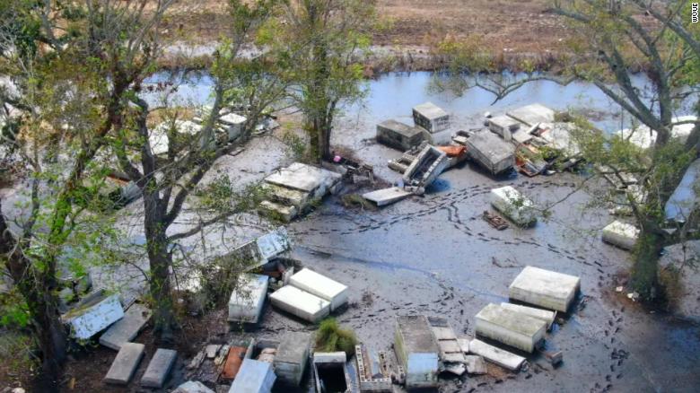 Caskets are still scattered around a Louisiana community as residents struggle to recover from Hurricane Ida