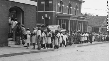 Despite being warned to keep away from the polls, thousands of Black residents turned out to vote in Democratic primaries held July 17, 1946, in Marietta, Georgia.