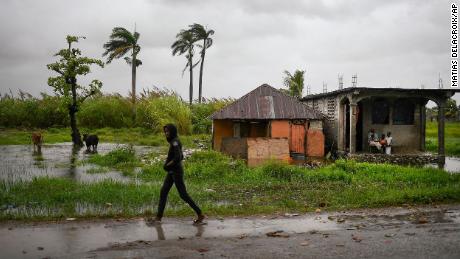 A man walks in an area that was flooded by Tropical Storm Grace, in Trou Mahot, Haiti, on August 17. The storm struck just days after a 7.2-magnitude earthquake. 