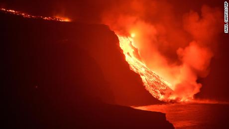 Lava from a volcano reaches the sea on the Canary island of La Palma, Spain in the early hours of Sept. 29, 2021. Lava from the new volcano on the Canary Island of La Palma reached the Atlantic ocean last night, at the area known as Los Guirres beach, also known as Playa Nueva (New Beach). 