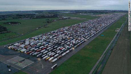 Trucks parked on the runway at Manston Airport in England waiting to cross the English Channel on December 22, 2020.