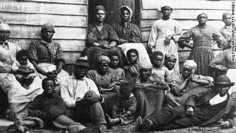 A portrait of Civil War-era fugitive slaves who were emancipated upon reaching the North in the mid-1860s. 