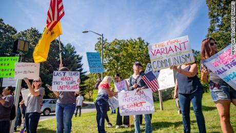 About 30 healthcare workers protest against state-mandated Covid-19 vaccinations outside St. Catherine of Siena Hospital in Smithtown, New York, on September 27.