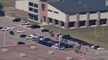Students walked out of Timberview High School after the shooting.