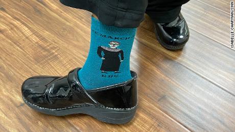 A nurse at Houston Women&#39;s Reproductive Services shows off her socks, honoring the late Justice Ruth Bader Ginsberg.