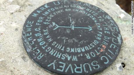 During his 2019 visit to St. Malo, Salgarolo found a small marker left by the US National Geodetic Survey. &quot;St. Malo&quot; was scratched onto the center of the marker. &quot;We had here this place-marking, which gave us a sense of where we were,&quot; he said.