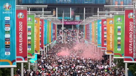 Supporters walk down Olympic Way ahead of the Euro 2020 final between Italy and England at Wembley Stadium on July 11, 2021.